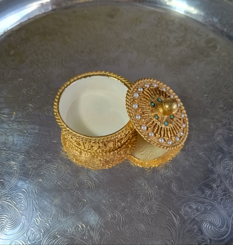 Small decorative gold box with turquoise and seed pearls