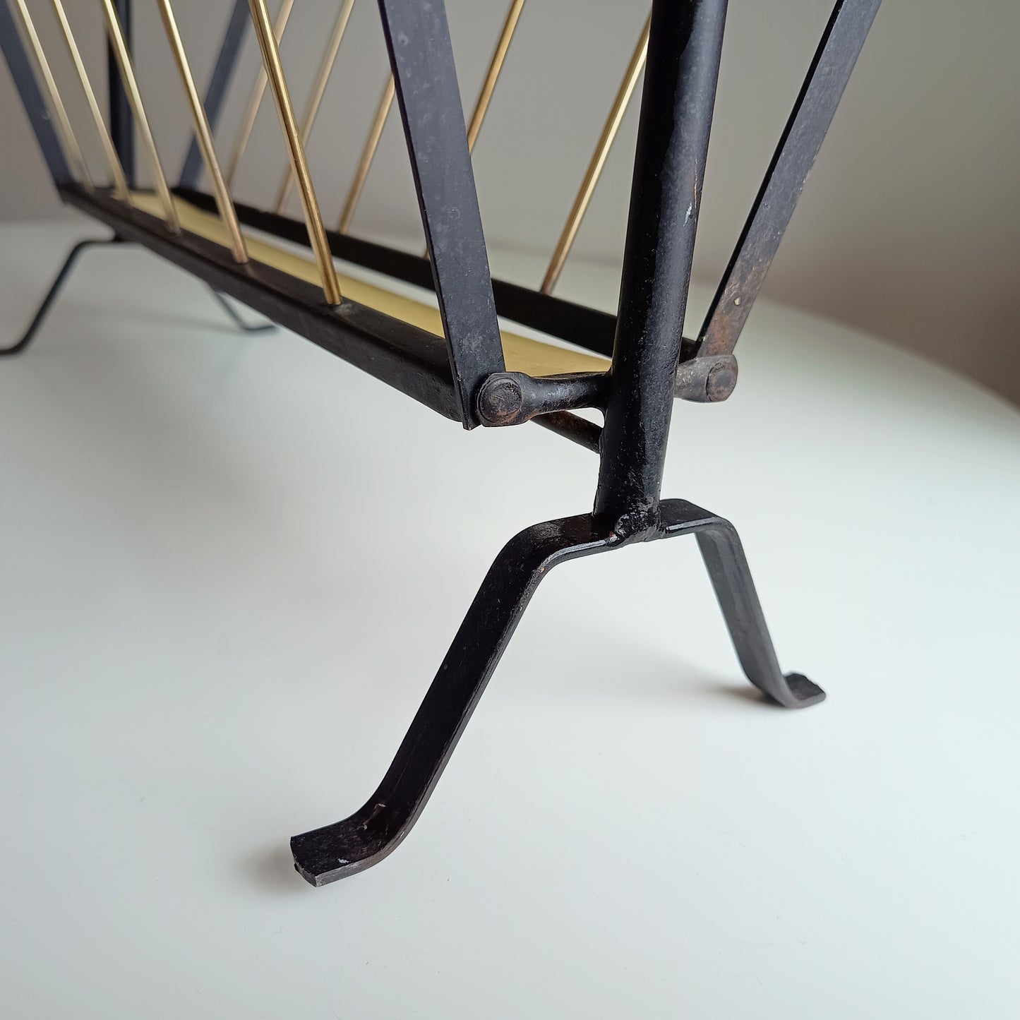 Authentic Vintage 1950s MCM Mid-Century Modern Brass Black Metal Magazine Rack in the style of Mathieu Matégot France or Cesare Lacca Italy