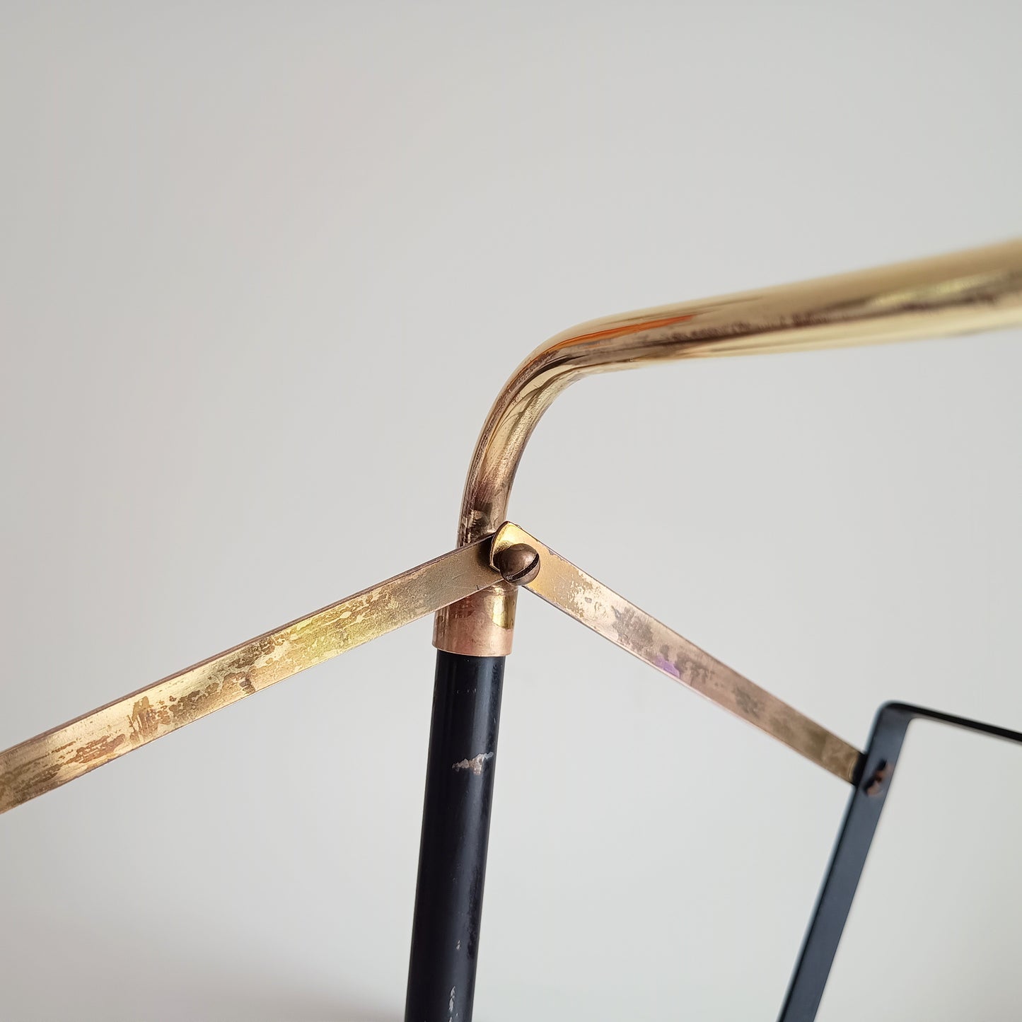 Authentic Vintage 1950s MCM Mid-Century Modern Brass Black Metal Magazine Rack in the style of Mathieu Matégot France or Cesare Lacca Italy