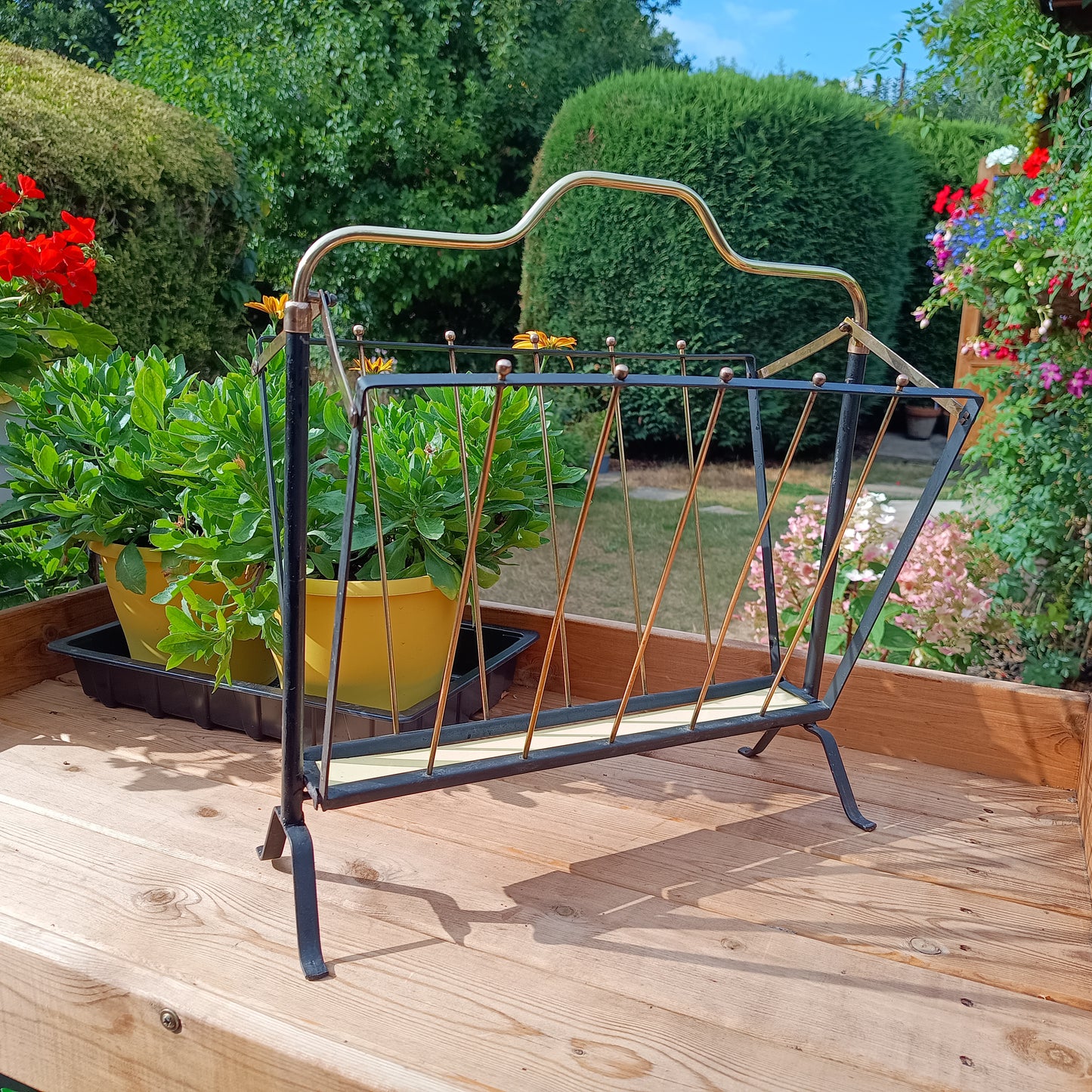 Authentic Vintage 1950s MCM Mid-Century Modern Brass Black Metal Magazine Rack in the style of Mathieu Matégot France or Cesare Lacca Italy