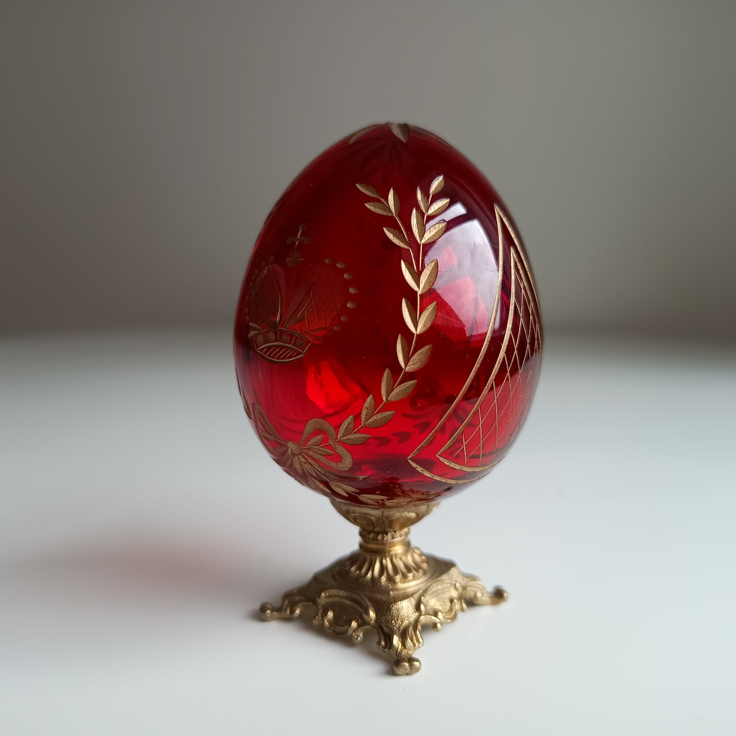 Vintage Ruby Glass Engraved Gilded Crystal Egg with Brass Mount in the style of Faberge, Desk / Shelf Styling Ornament