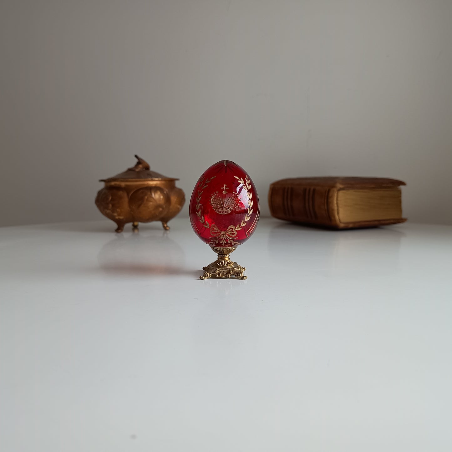 Vintage Ruby Glass Engraved Gilded Crystal Egg with Brass Mount in the style of Faberge, Desk / Shelf Styling Ornament