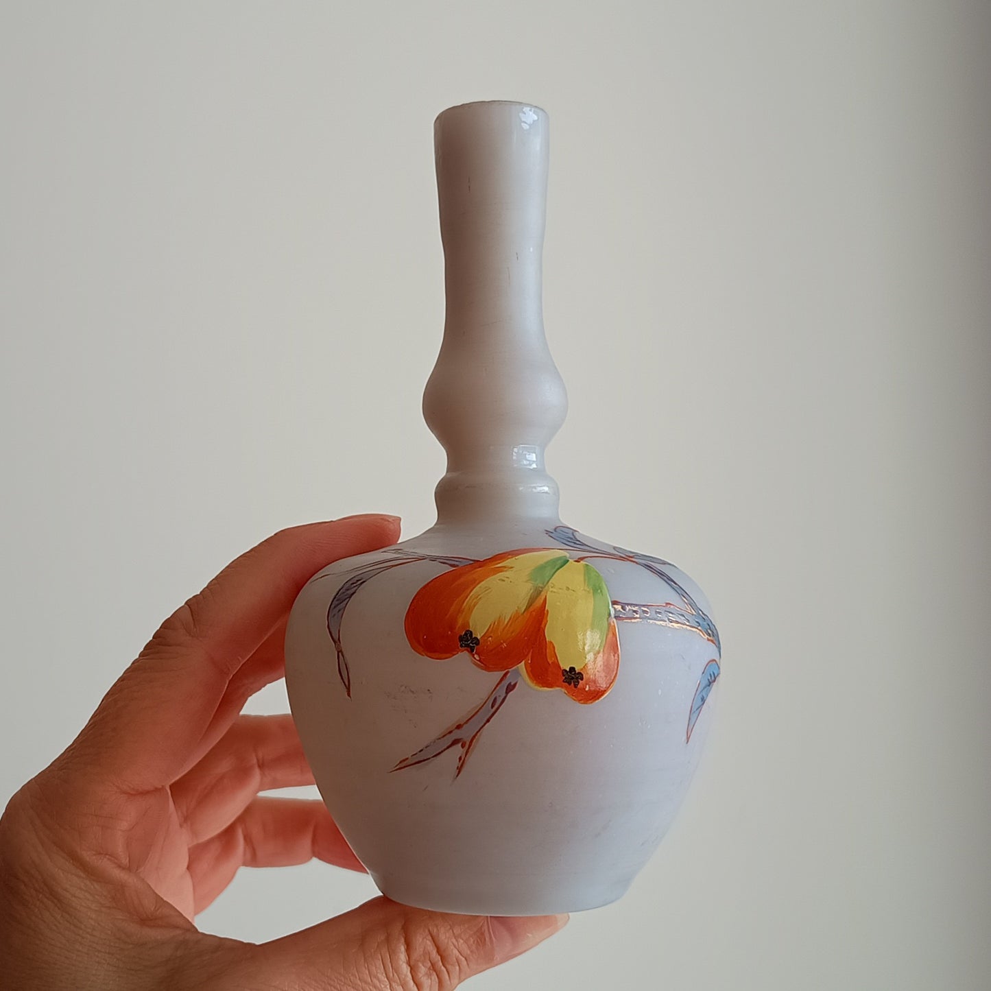 Art Nouveau coffee opaque soft glass vase has a bulbous Chinoiserie shape and a satin finish. It is hand-painted with early Art Nouveau style red and yellow flowers and grasses