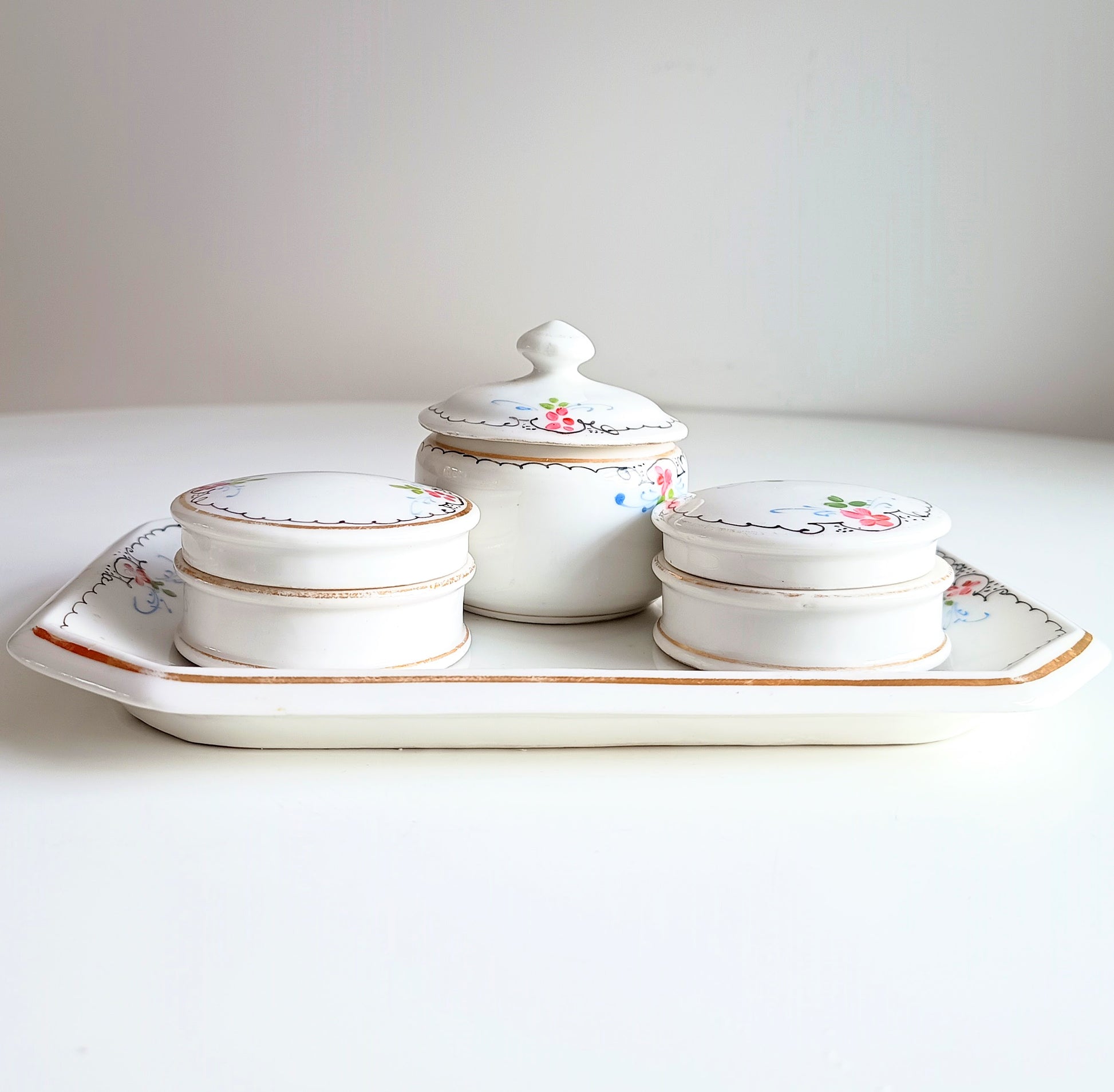 19th century French Porcelain Set of Hand-Painted Tray and 3 Lidded Pots
