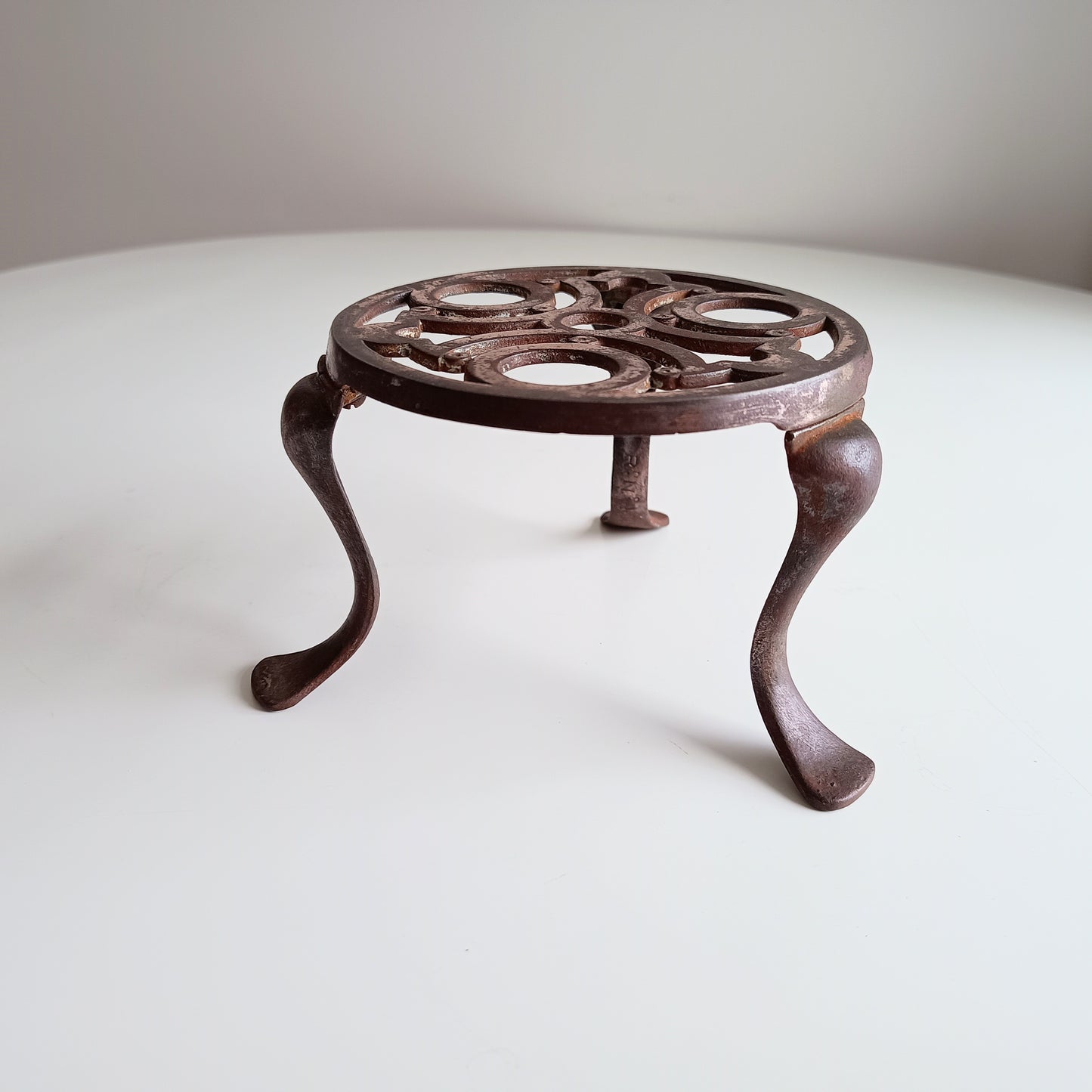 Antique English Art Nouveau Cast Iron Trivet, Registered design 430938 for 1906 on Three Bound Legs