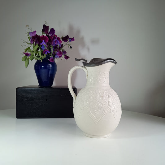 White Victorian Jug with Pewter Lid English Antique Blue Vase with purple sweet peas flowers on the background 