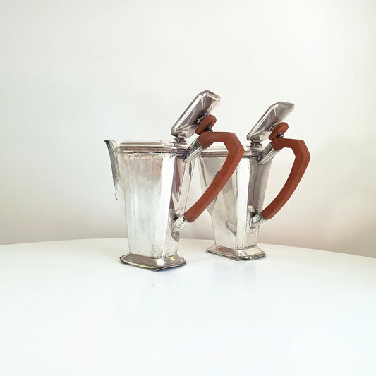Pair of Art Deco égoïste coffee pots with chocolate brown handle and lids look identical