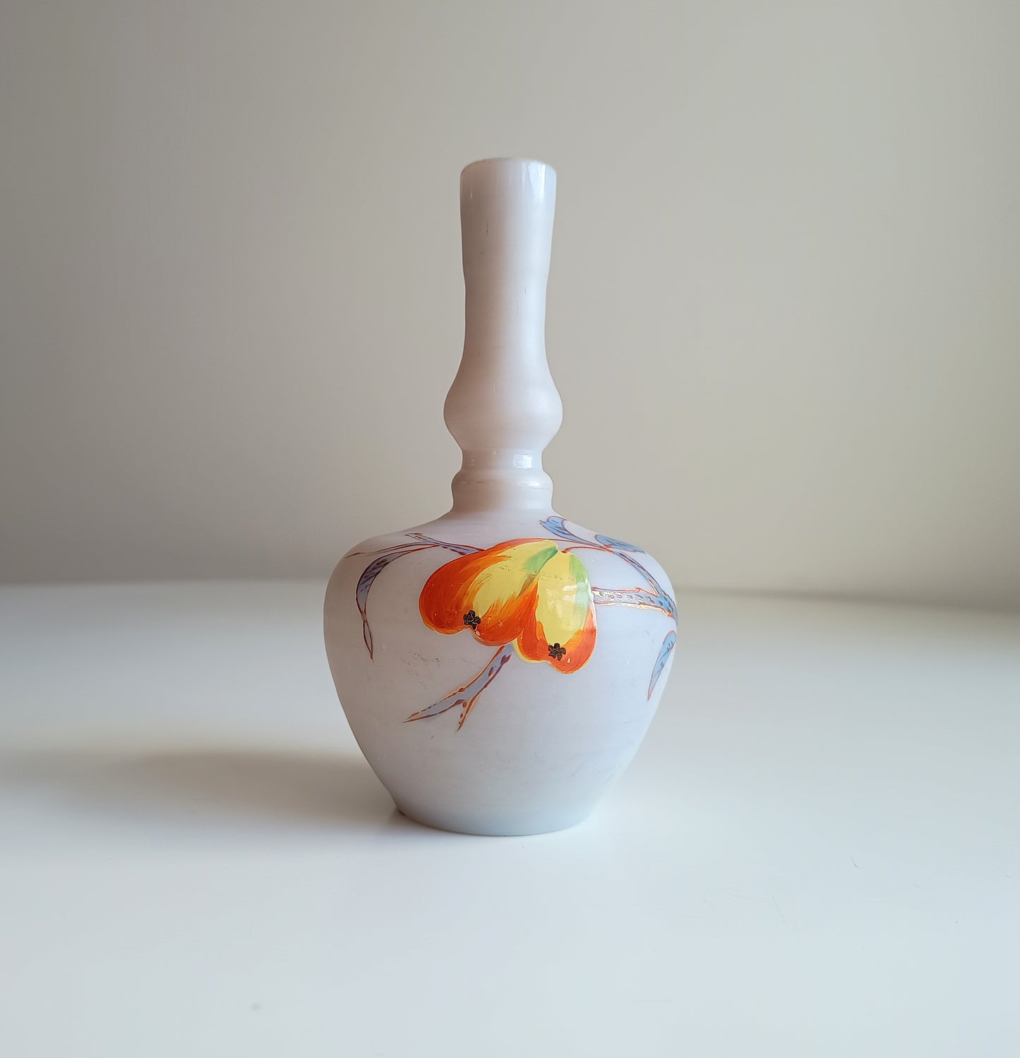 Art Nouveau coffee opaque soft glass vase has a bulbous Chinoiserie shape and a satin finish. It is hand-painted with early Art Nouveau style red and yellow flowers and grasses 
