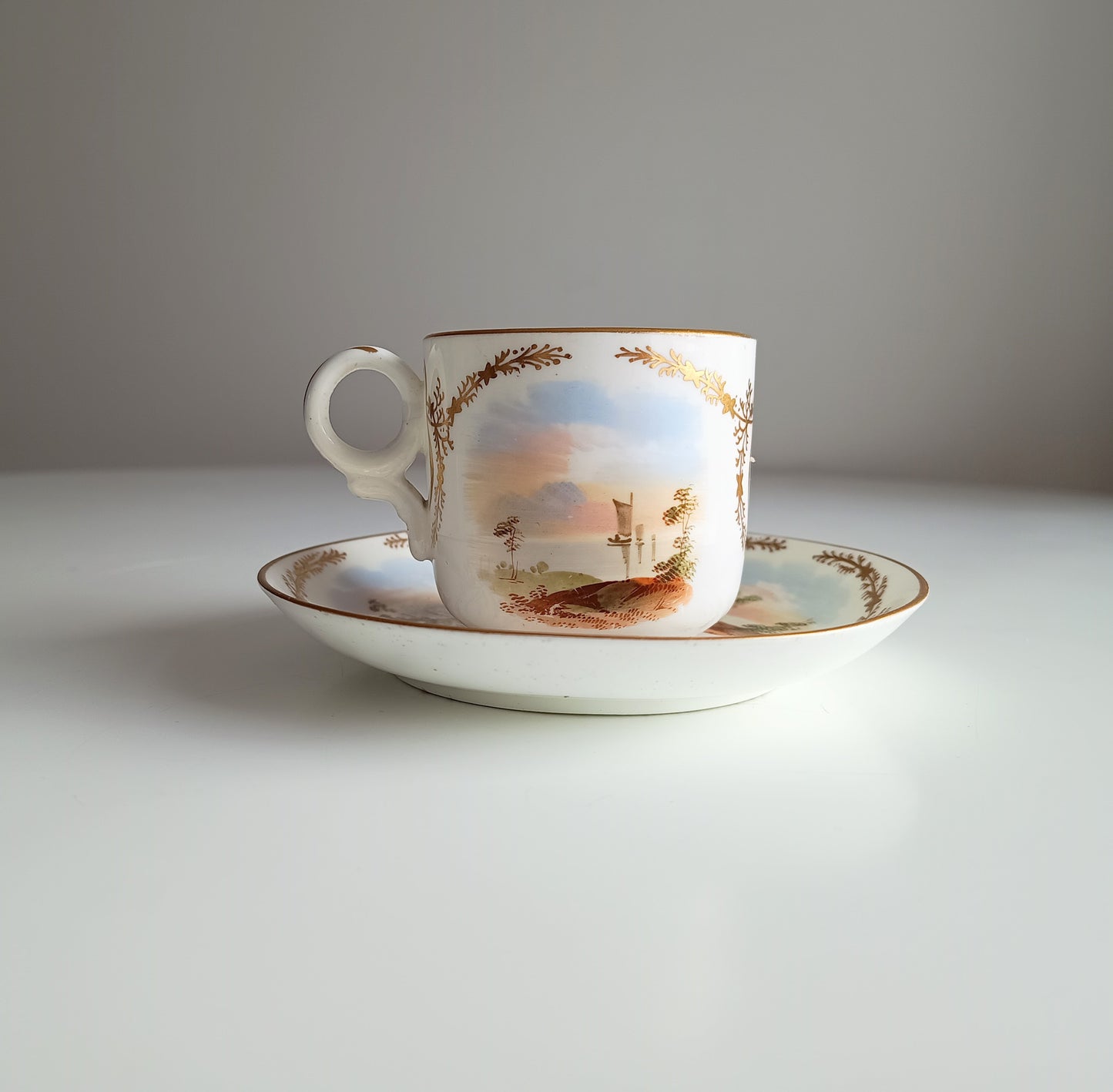 Antique Hand-Painted Landscape and Gilt Crests Porcelain Cup & Saucer, Austria 19th century